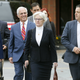 Erdely, left, and Rolling Stone magazine Deputy Managing Editor Sean Woods, right, walk with their legal team to federal court in Charlottesville, Va. this week. Photo via AP